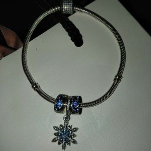 Pandora 8-inch bracelet with three Pandora pieces